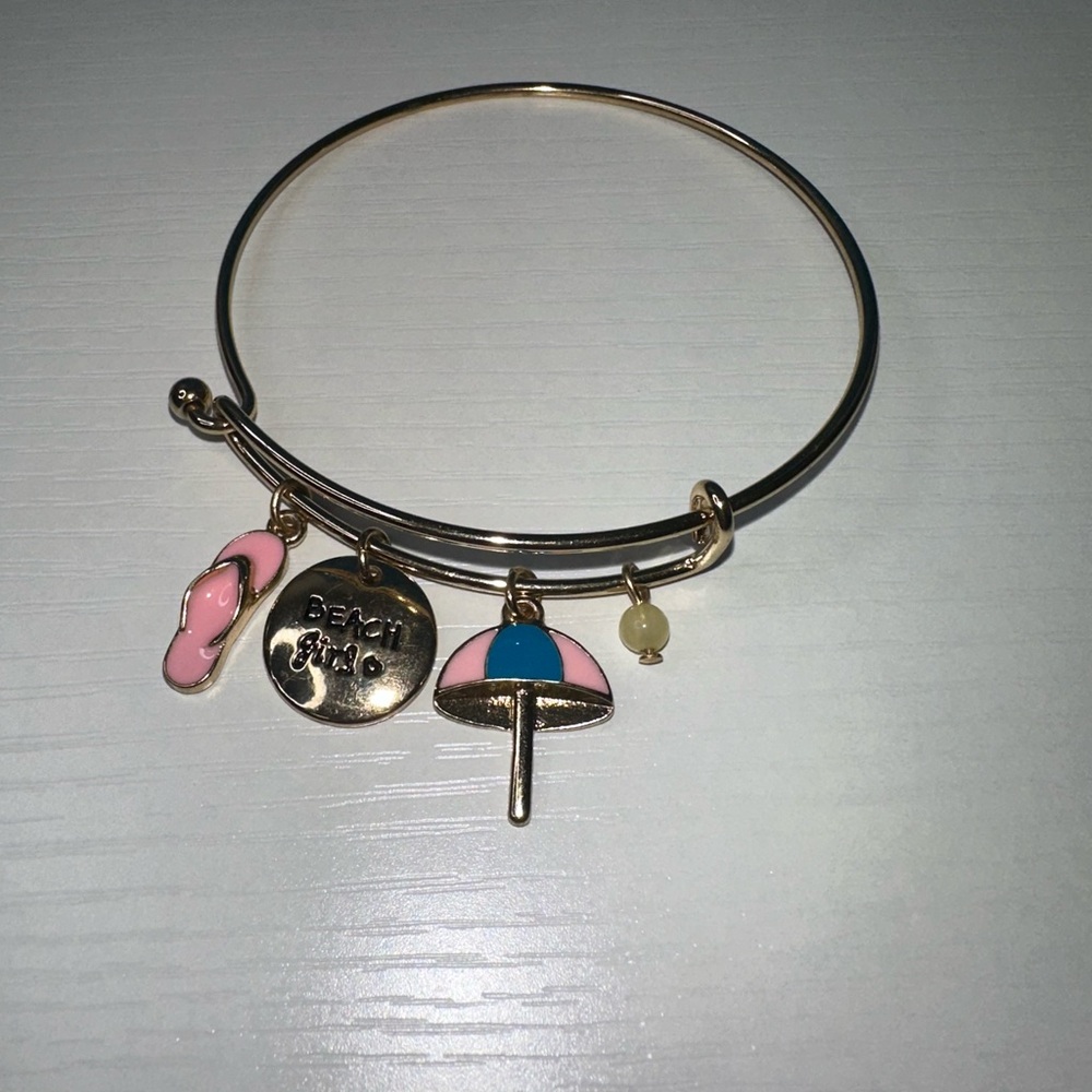 Women’s Avon Gold Tone ‘Beach Girl’ Charm Bracelet